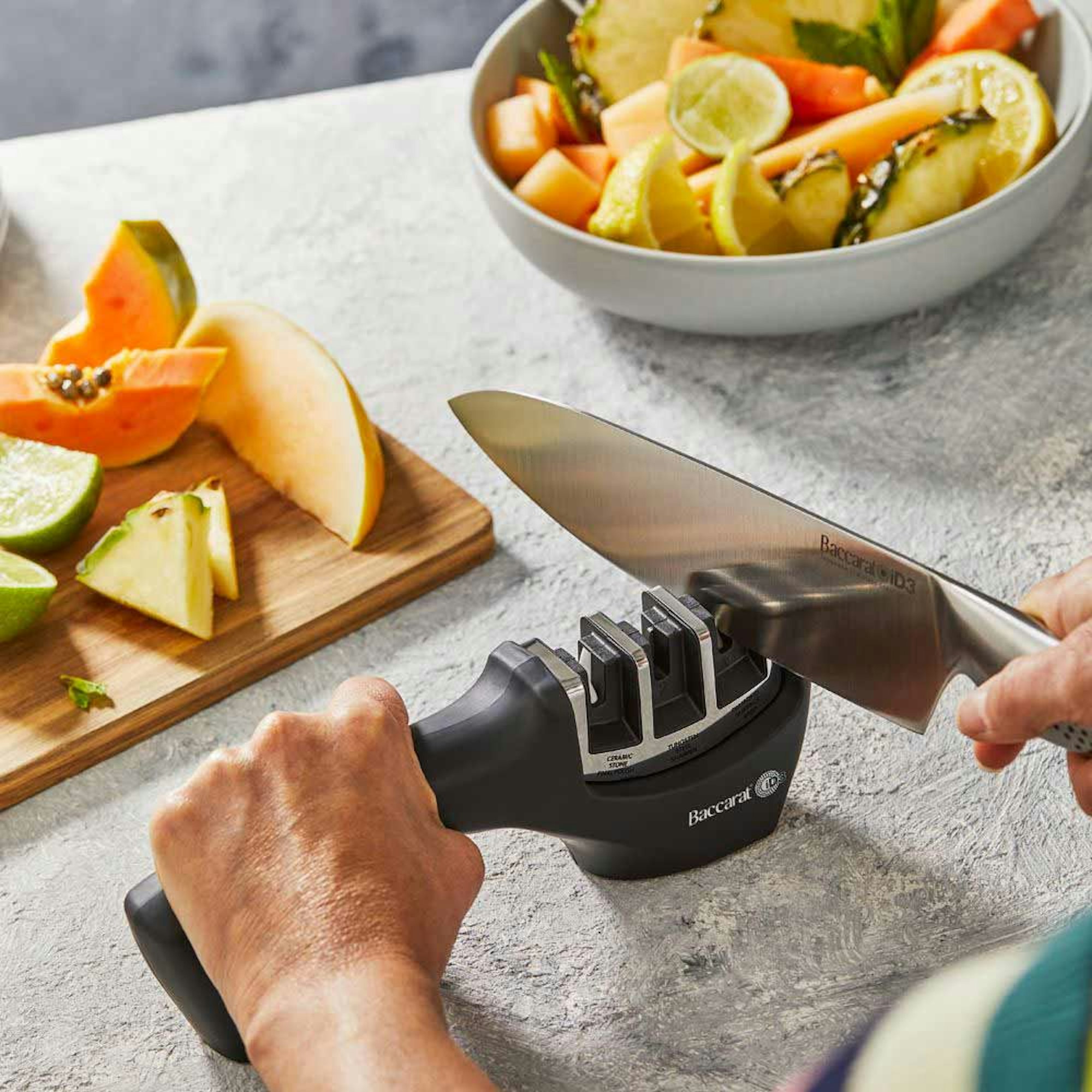 Woman sharpening a knife - How to Sharpen a Knife House Blog